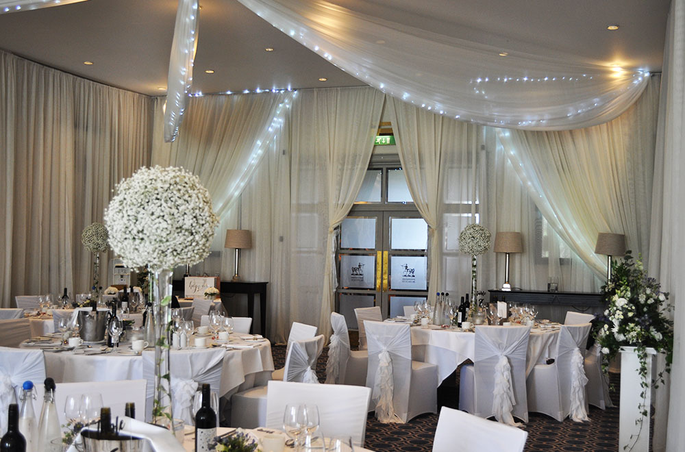 Tied back entrance drapes with fairy lights at Bowood Hotel, spa and gold resort 