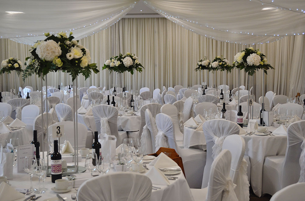 Ivory white ruffle hoods for a wedding at De Vere Cotswold Water park Hotel wedding breakfast