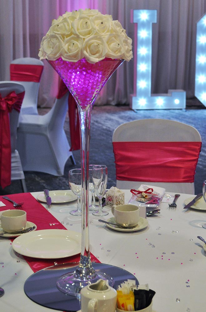 Large Martini glass wedding table centrepiece center with LED illuminated Pink Gel Balls and crystals