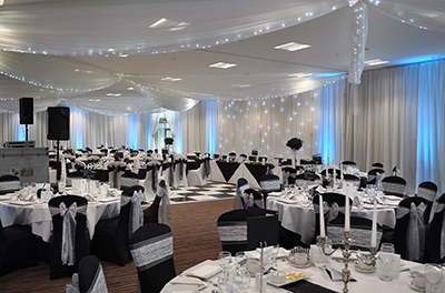 Hollywood Glamour themed wedding, with full room and ceiling drapes, at the Cotswold Water Park Hotel