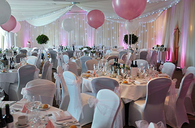 Pink wedding, with room and ceiling drapes, at the Cotswold Water Park Hotel