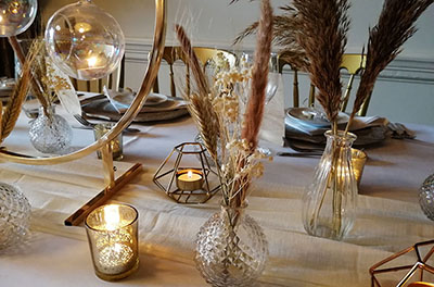 Geometric styled table, with candles, glassware and lots of pampas grass