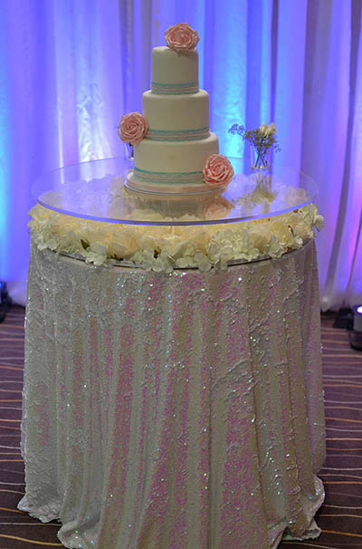 Ivory rose floating cake table, with sequin tablecloth