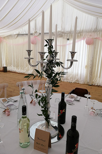 Silver candelabra centrepiece, with added foliage, at Stanton Manor Hotel