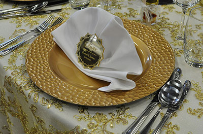 Gold charger plate placesetting, with laser cut acrylic placecard