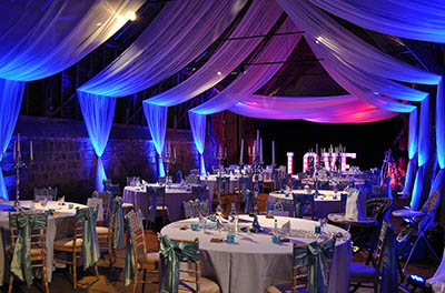 Wick Bottom Barn, with ceiling drapery and lighting for a wedding