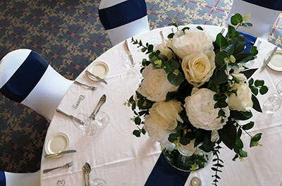Wedding breakfast table, in navy blue satin, at Wrag Barn Golf Club