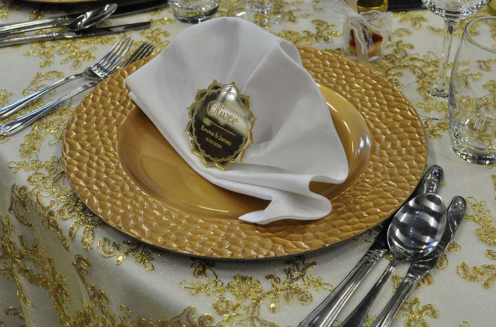 Gold embroidery table covering with gold charger plate