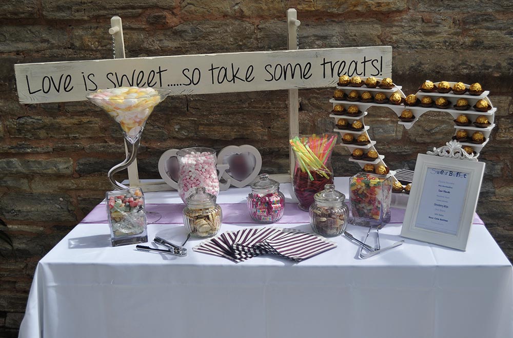 Love is sweet sign and table top sweet buffet display in Swindon