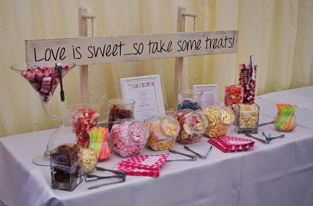 Sweet buffet table top display in Swindon for Hire sign