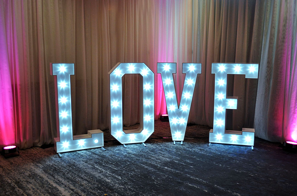 Large 5ft White illuminated LOVE letters with white fairground style LED lamps